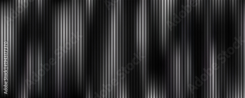 Monochrome abstract image featuring dynamic light waves in black and white, creating a sense of movement with sharp