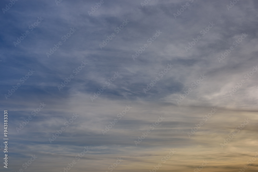 Fototapeta premium Blue cloudy sky. Serene dreamy background. Photo of a natural cloudscape