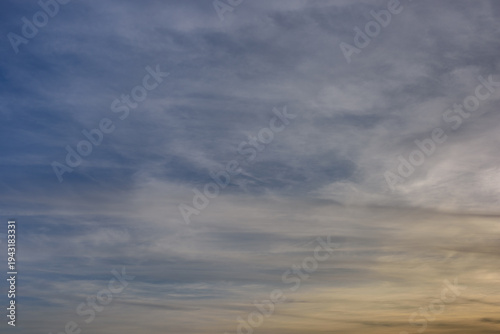 Blue cloudy sky. Serene dreamy background. Photo of a natural cloudscape