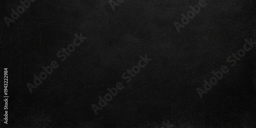 Black paper texture with a dark grunge surface and a rough vintage canvas pattern creates a blank grey wall backdrop for an old textured material design