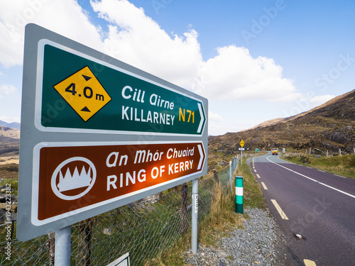 Photography Road sign with direction to Killarney and ring of Kerry, famous and popular travel area in Ireland