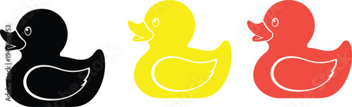 Three rubber ducks in black yellow and red on a white background bath toy yellow duck