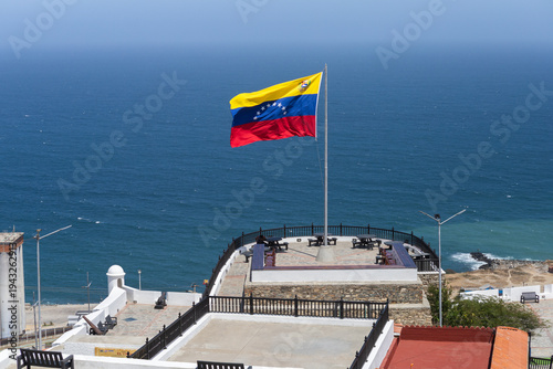 El Vigía fort in La Guaira, Venezuelan flag waving in the Caribbean Sea
