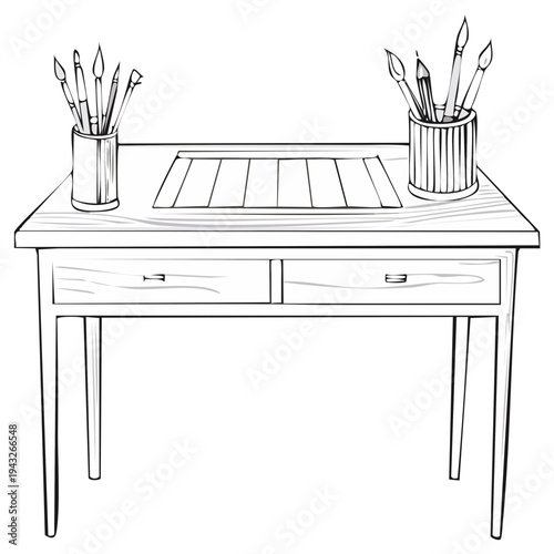 Artist's desk with paintbrushes and palette ready for creativity