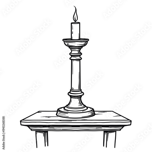 Candle on a decorative stand with flame on wooden table  