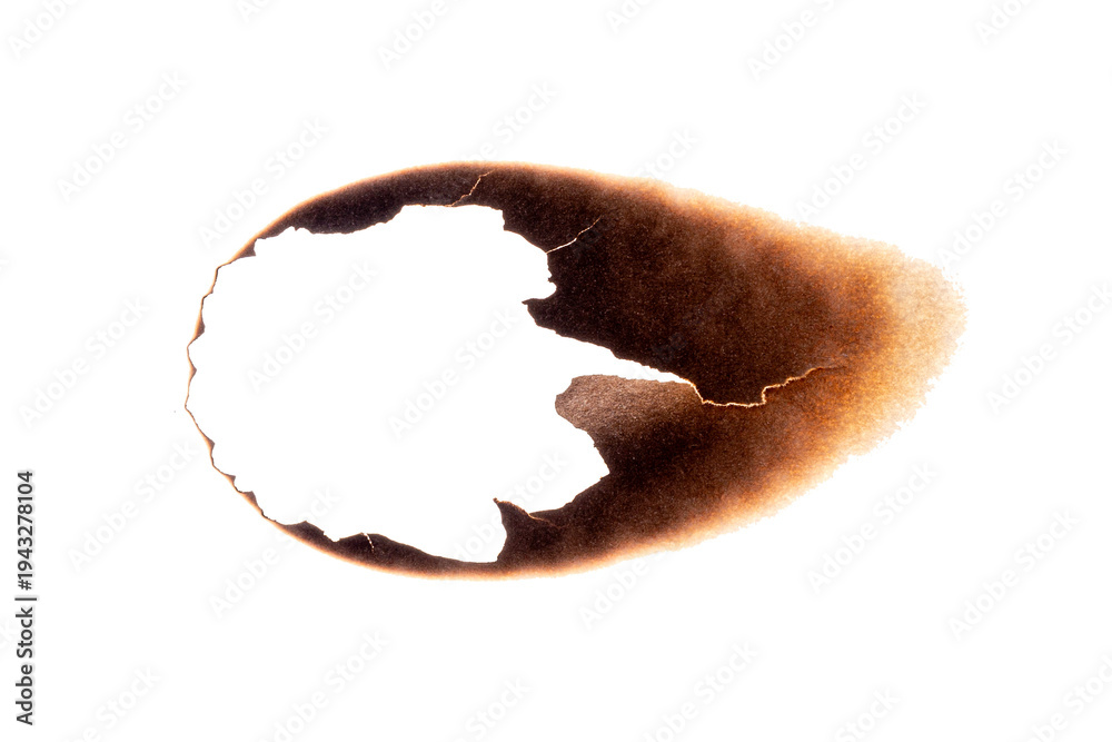 Fototapeta premium Paper sheet with irregular burnt hole and dark scorch marks isolated on white background