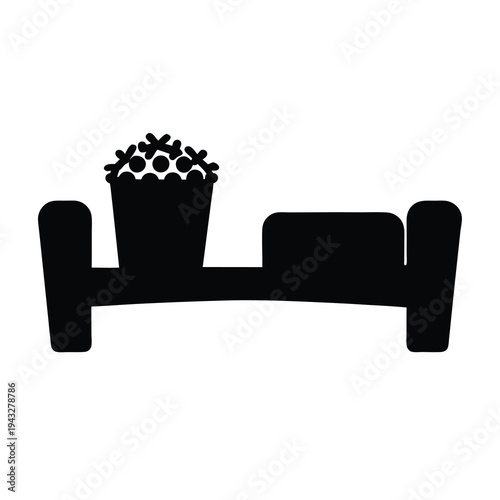 Stylized image of popcorn on a sofa, perfect for watching a movie