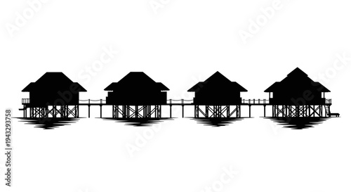 Silhouette of four overwater bungalows connected by a walkway on a calm sea