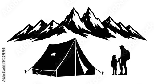 Silhouette of a father and child camping with a tent and majestic mountains in the background