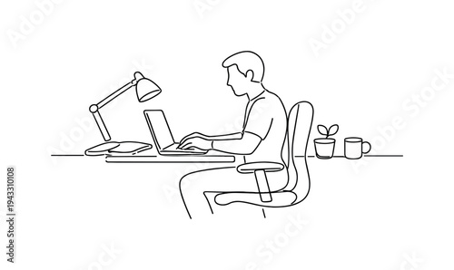 Freelancer sitting at a desk typing on a laptop, ergonomic chair tucked in, desk lamp angled over a notebook, small potted plant