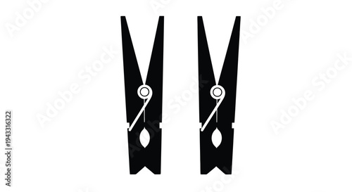 Two black clothespins isolated on a white background