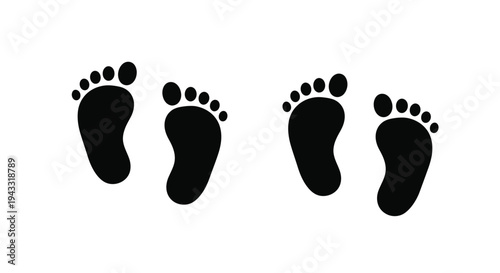 Four black footprints showing a walking path simple silhouette