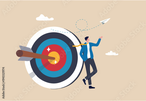 Business objective, purpose or target, goal and resolution to aim for success, aspiration and motivation to achieve goal concept, confident businessman stand with arrow hit bullseye on archery target