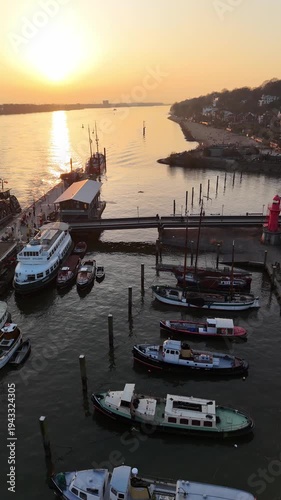 Hamburg Germany 2026 03 09: Aerial drone footage (vertical format) of the Museum Harbor at the Elbe River in Hamburg Övelgönne during magnificent sunset