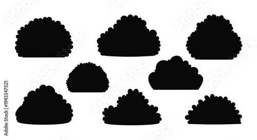 Black bush shapes arranged on a white background a striking silhouette