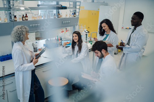 Scientists team collaborating in a modern laboratory research setting