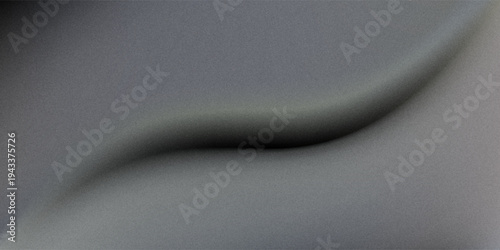 Grainy textured surface backlit, casting dramatic shadowy gradient across darkened plane