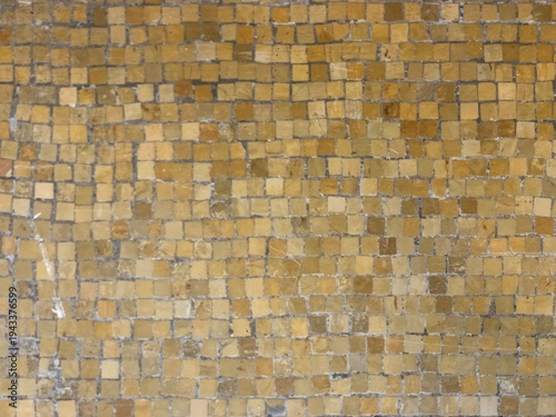 Slika na platnu Uniform grid of golden aged yellow ocher tilework stone tesserae historic mosaic