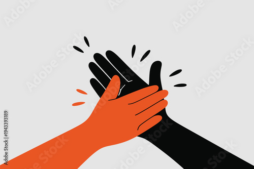 Orange and black hands giving high five symbolizing teamwork.