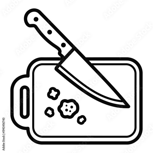 Chef's knife resting on a cutting board with scattered food scraps, indicating preparation.