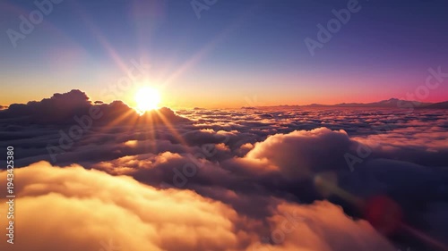 Aerial view of breathtaking sunrise above clouds, 4k video footage, cinematic motion clip