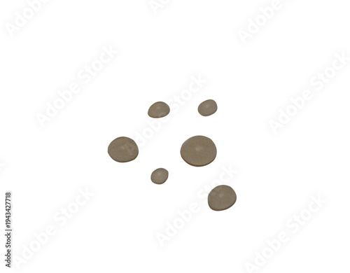 Natural spa pebbles arranged in a minimal composition isolated on a light background. Smooth rounded stones commonly used for wellness, meditation, massage therapy and relaxation concepts.