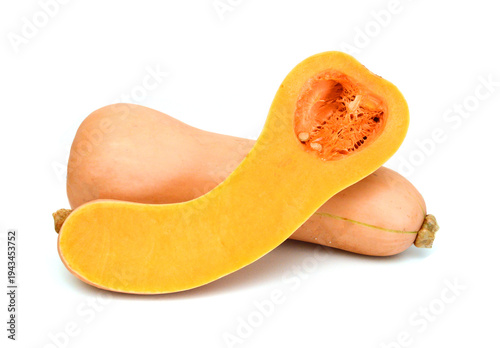 Bottle shaped butternut pumpkin and a cut one on a white background 