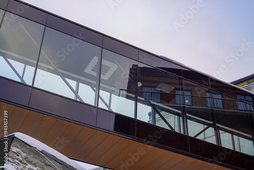 Modern building with glass and wooden features in a winter setting at Ulemiste city.