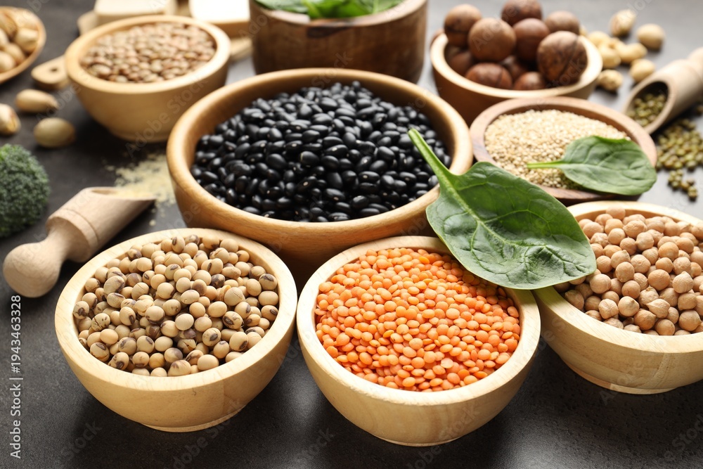 Naklejka premium Different vegetarian food products rich in protein on grey table, closeup