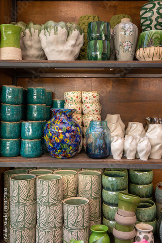 Variety of flower vases and plant pots at garden shop in spring.