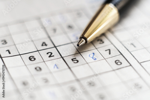 Solving Sudoku Puzzle with Pen Close Up