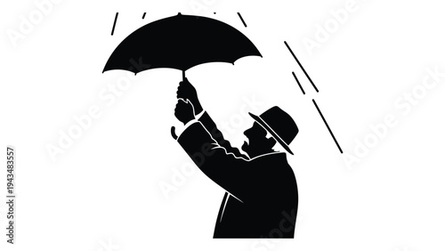 Man in a hat struggling to hold an umbrella in the wind