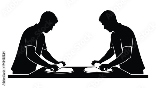 Two people preparing food on a table