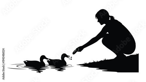 A woman feeds two ducks by the water