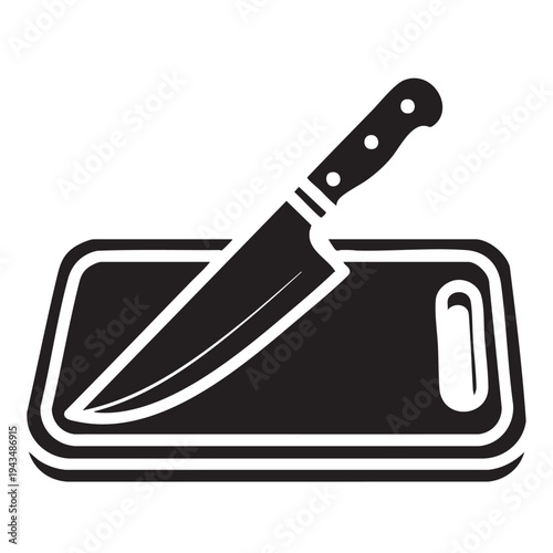 A chef's knife lies on a cutting board.
