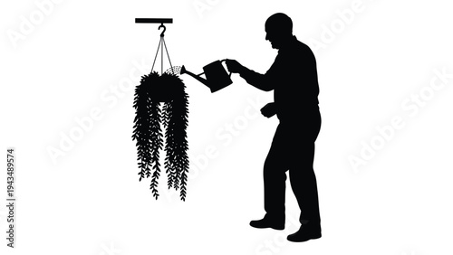 Man watering hanging plant