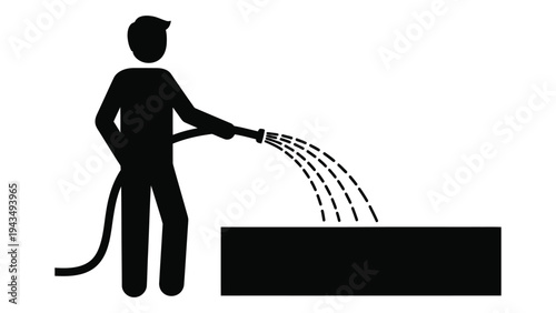 Man using a hose to water a rectangular area