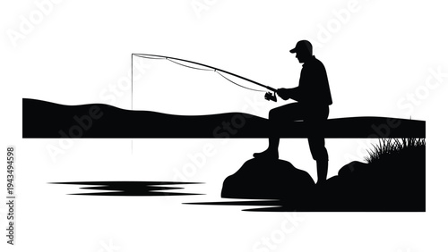 Man fishing on a rock by the water