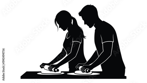 A man and woman preparing food on plates