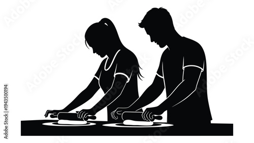 A man and woman preparing food at a table