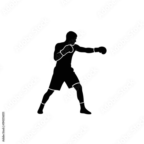 Boxer in fighting stance throwing punch.