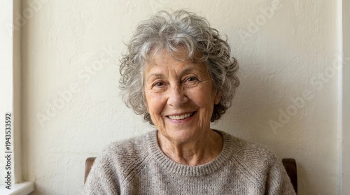 Happy Senior Woman with Gray Curly Hair Smiling at Camera
