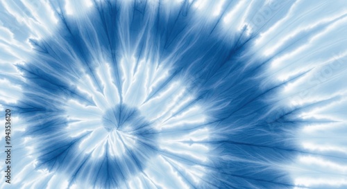 Tie dye pattern in blue and white, abstract spiral design, textile background