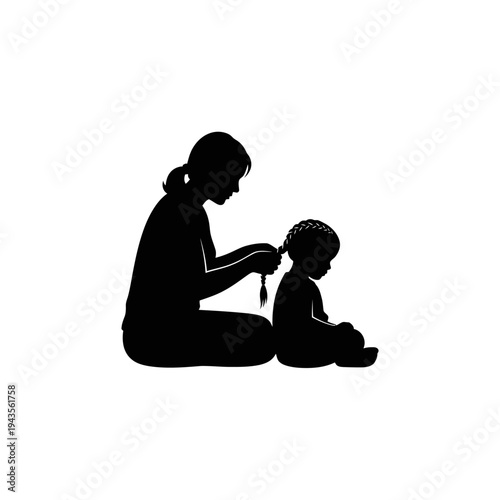 Woman braiding little girls hair.