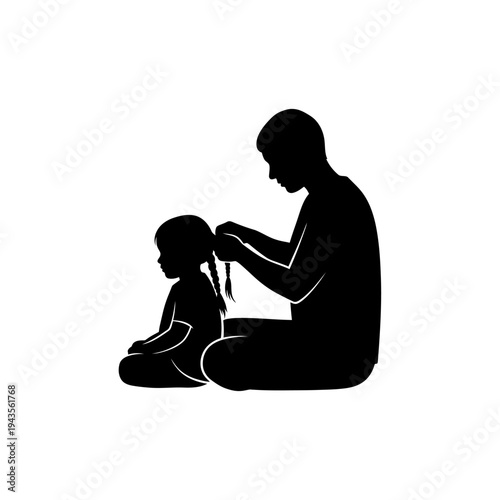 Father braids young daughters hair.