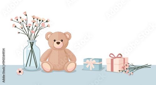 A charming light brown teddy bear sits on a pale blue surface next to a glass vase with pink flowers and two wrapped gift boxes.