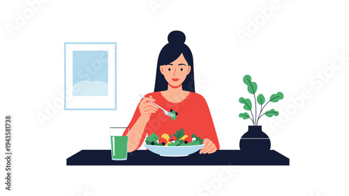 Young woman sits at a table and eats a fresh green salad with a glass of juice, promoting a healthy diet and nutrition.