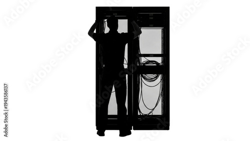 Silhouette of IT Professional Installing or Maintaining Server Rack in a Data Center Environment