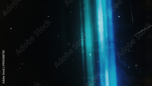 Cuadro en lienzo Abstract vertical glowing cyan and electric blue streaks with heavy analog film grain, dust particles and scratches on deep black void background