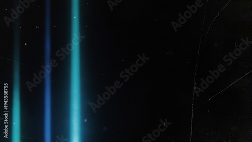 Abstract vertical glowing cyan and electric blue streaks with heavy analog film grain, dust particles and scratches on deep black void background. Light leak texture with analog film effects,...
